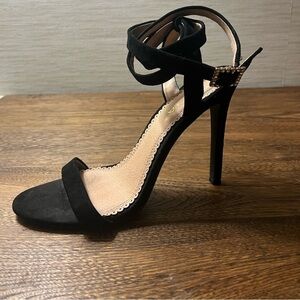 Black strappy heels.